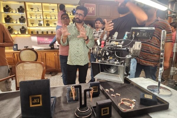 Film crew shooting scene inside jewelry store